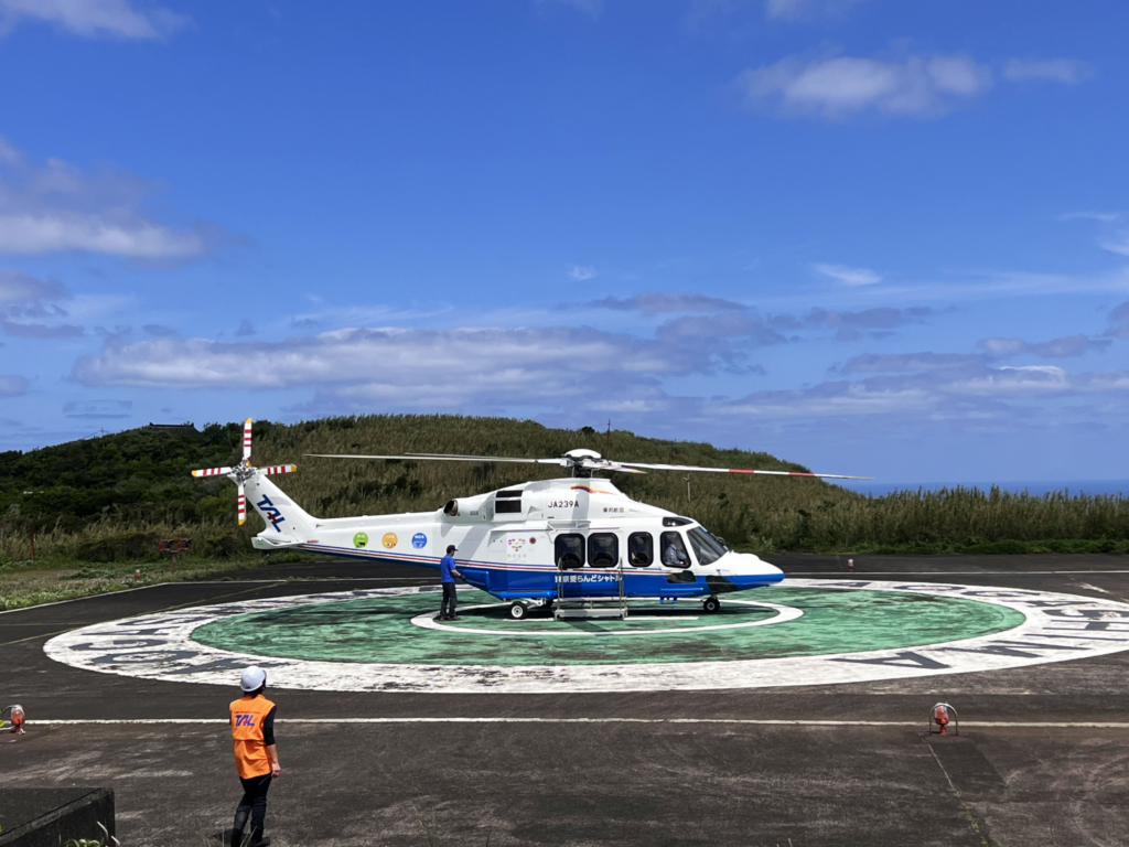 Tokyo Island Shuttle helicopter landing on the helipad to Aogashima